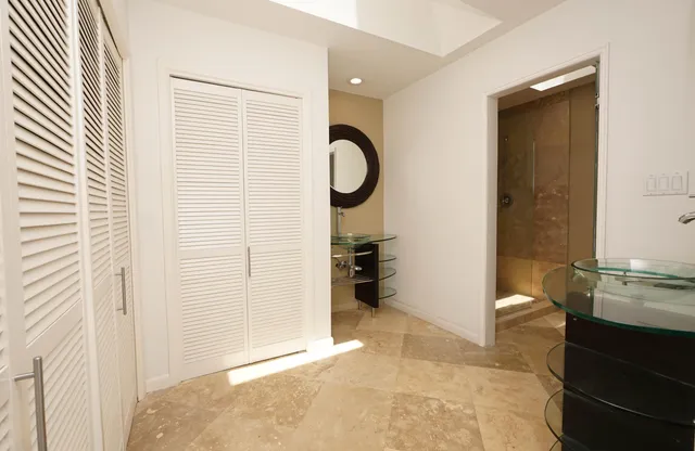 a view of a kitchen with a sink and a window