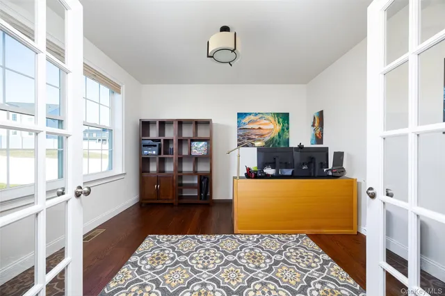 a bedroom with furniture and a window