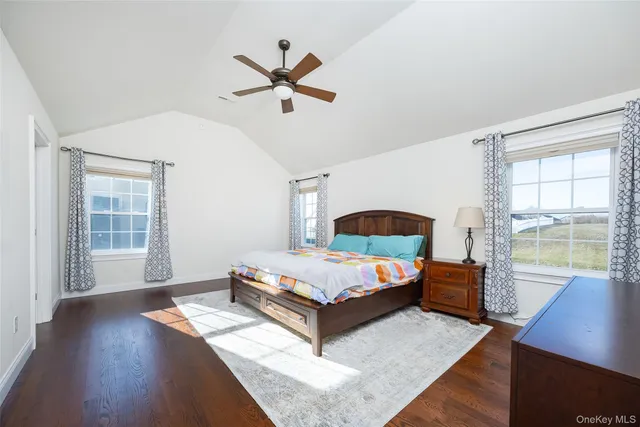 a living room with a bed furniture and a window