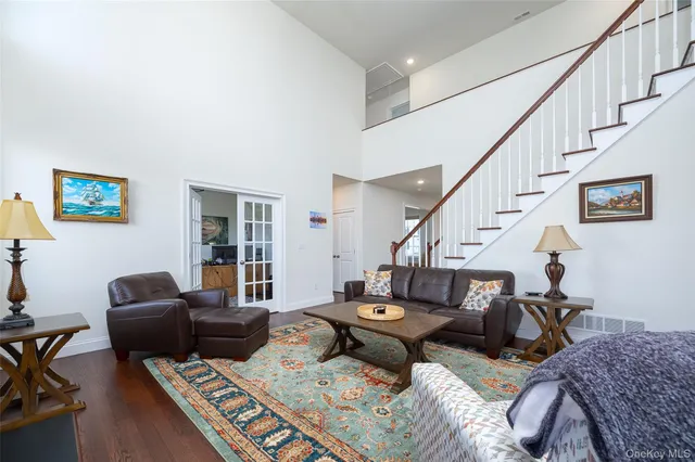 a living room with furniture or couch and a piano