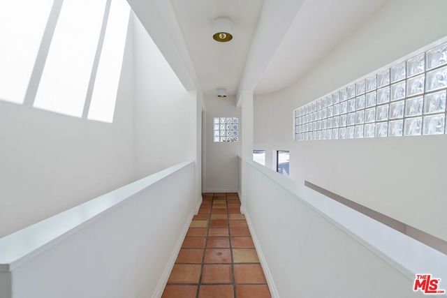 a view of a hallway with a white walls