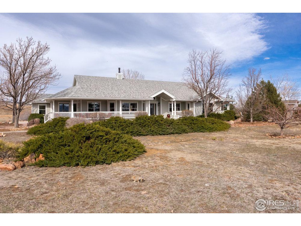 8923 Sage Valley Road Longmont, CO 80503 - Photo 1 of 40 a front view of a house with a yard