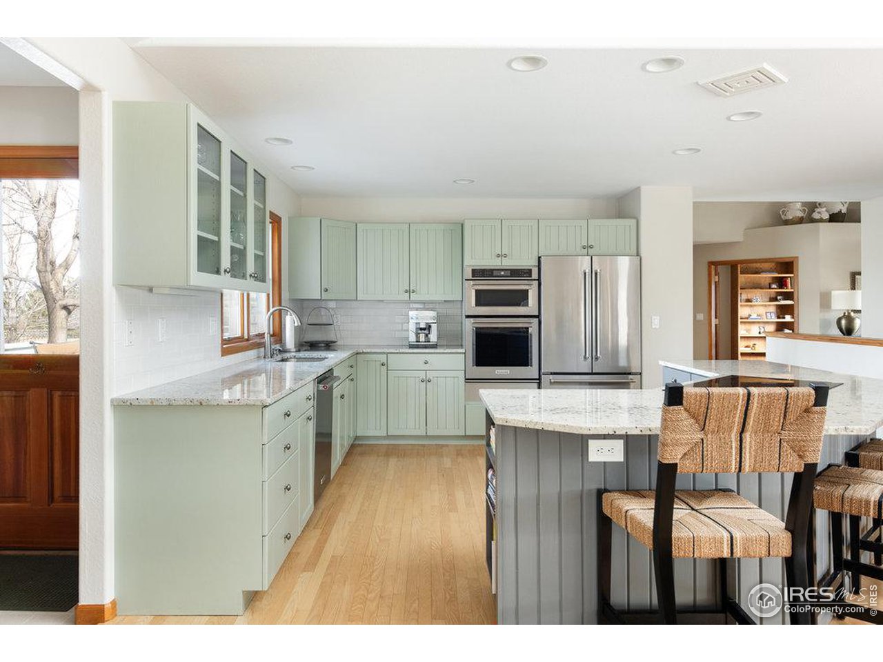 8923 Sage Valley Road Longmont, CO 80503 - Photo 14 of 40 a open kitchen with cabinets a sink and appliances