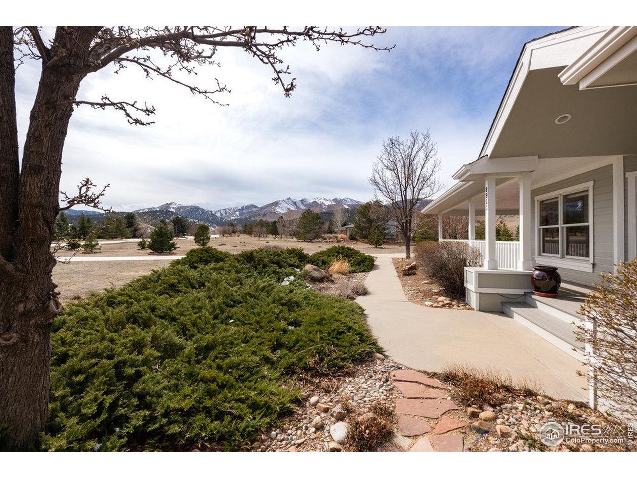 8923 Sage Valley Road Longmont, CO 80503 - Photo 2 of 40 a view of a house with a yard