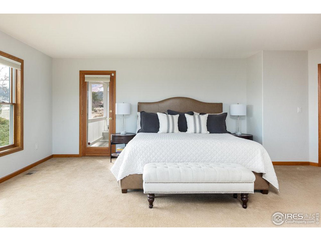 8923 Sage Valley Road Longmont, CO 80503 - Photo 25 of 40 a bedroom with a bed and a window