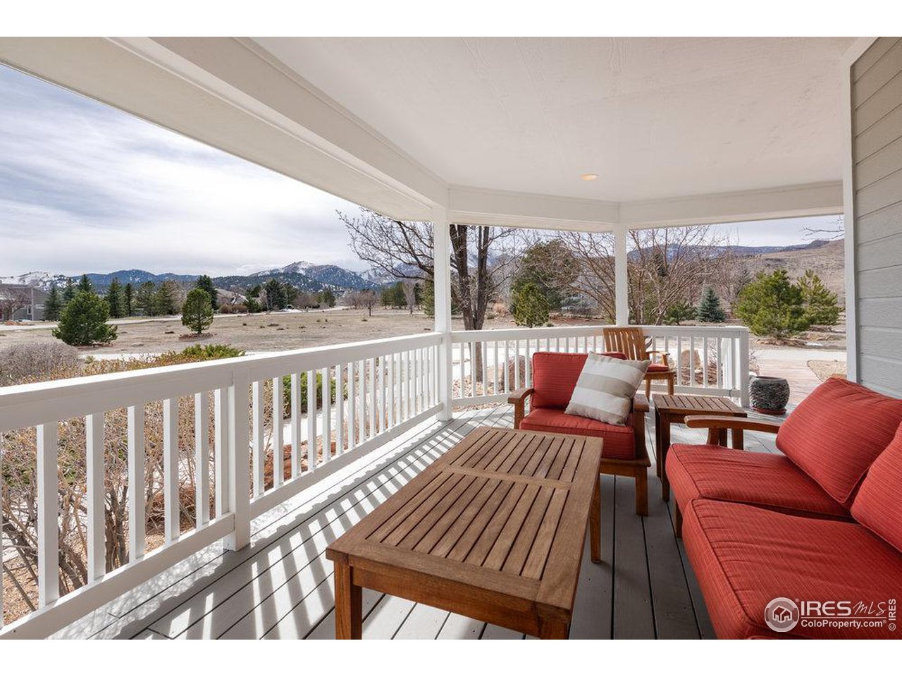 8923 Sage Valley Road Longmont, CO 80503 - Photo 3 of 40 a view of a chairs in wooden deck