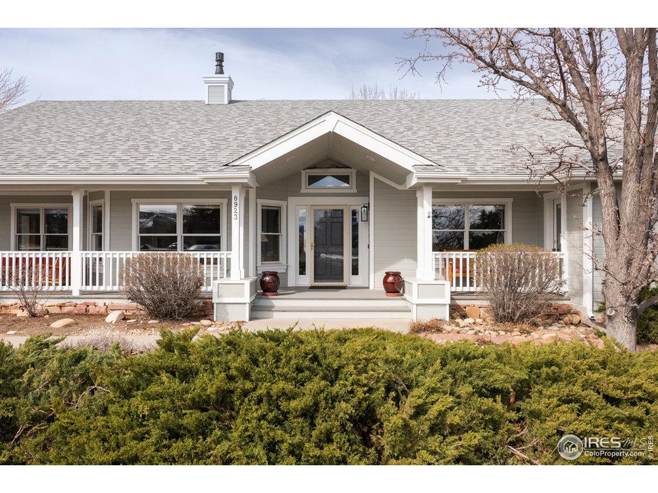 8923 Sage Valley Road Longmont, CO 80503 - Photo 5 of 40 a front view of a house with a garden