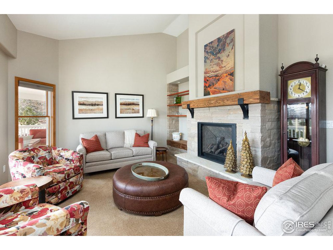 8923 Sage Valley Road Longmont, CO 80503 - Photo 7 of 40 a living room with furniture a window and a fireplace