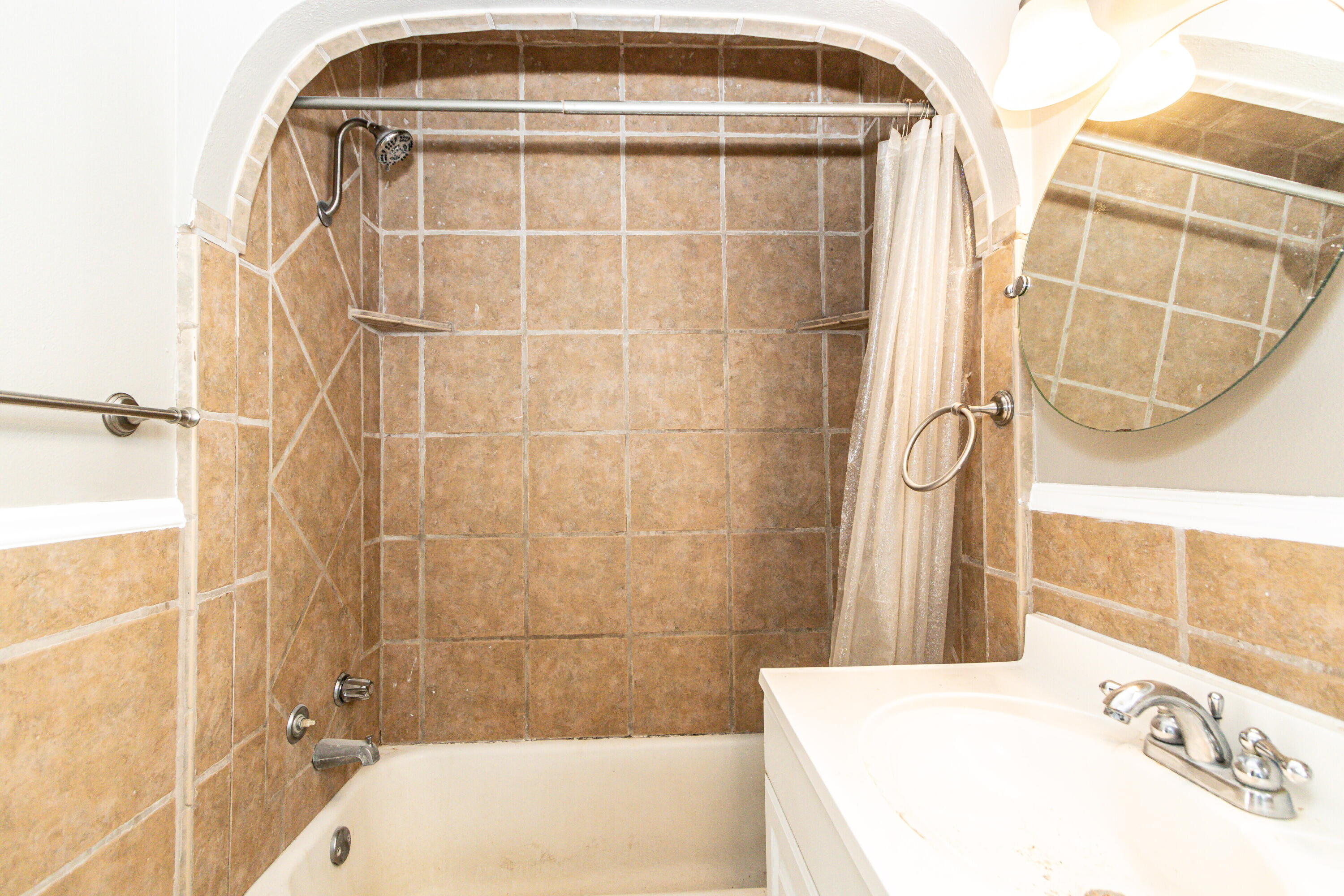 2417 25th Street Lubbock, TX 79411 - Photo 17 of 25 a bathroom with a tub and shower