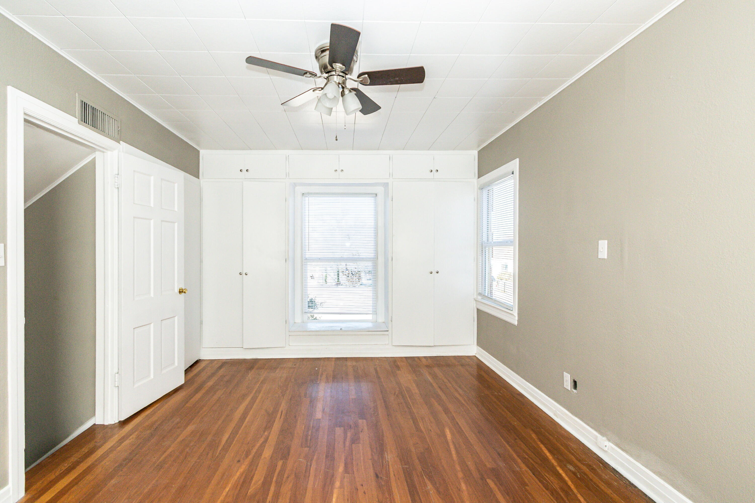 2417 25th Street Lubbock, TX 79411 - Photo 21 of 25 wooden floor in an empty room with a window