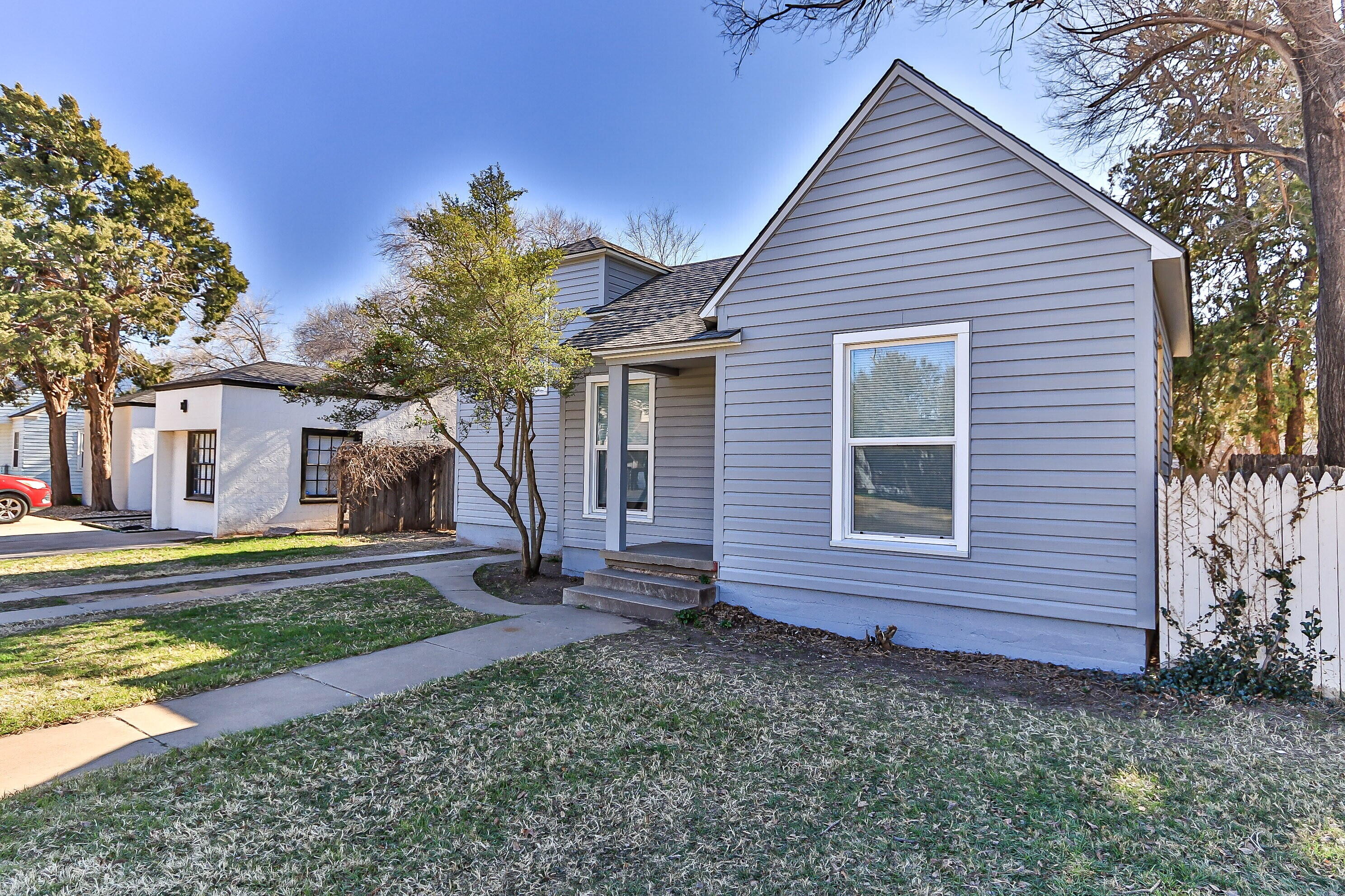 2417 25th Street Lubbock, TX 79411 - Photo 4 of 25 a view of a house with a yard