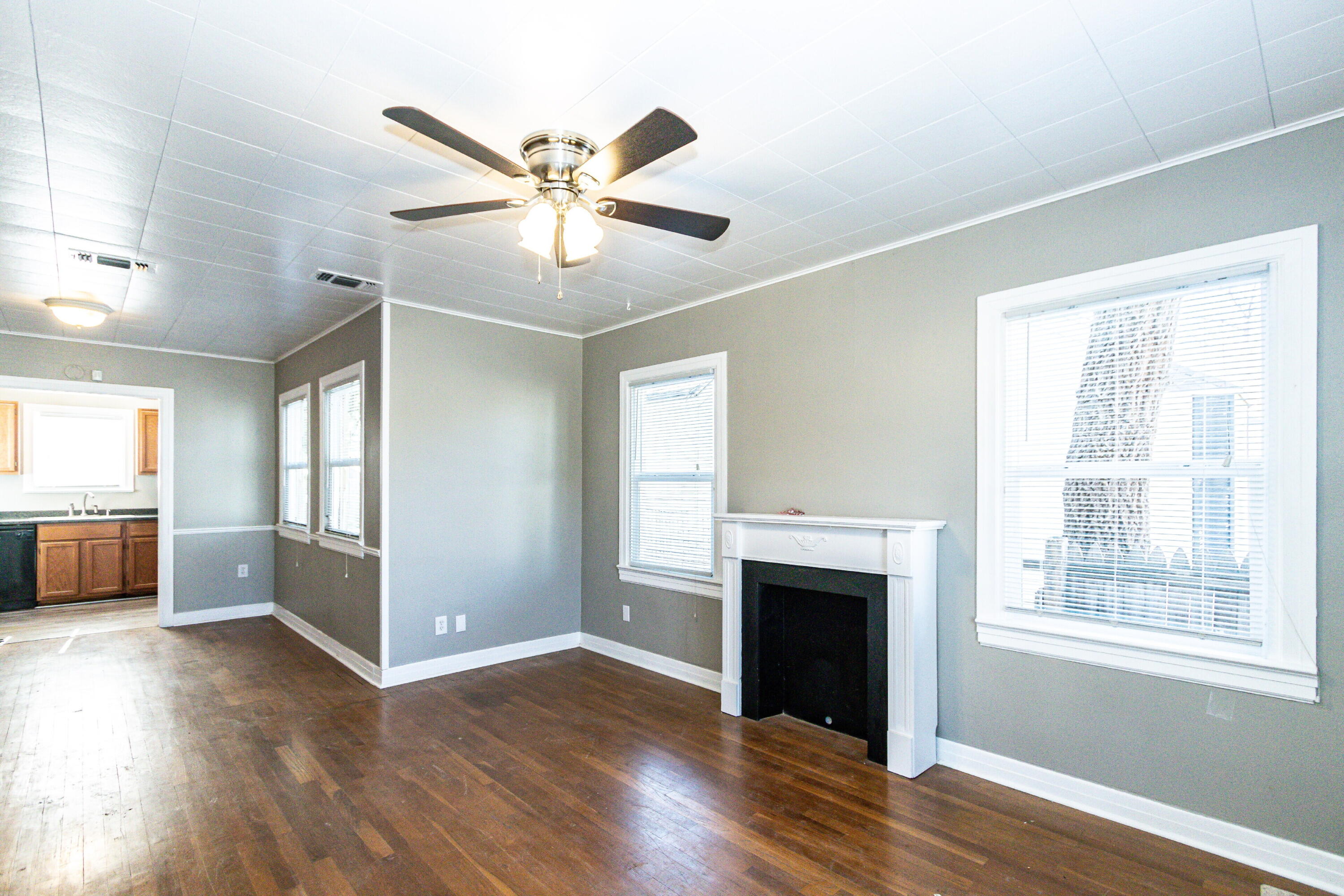 2417 25th Street Lubbock, TX 79411 - Photo 5 of 25 a view of empty room with wooden floor and fan
