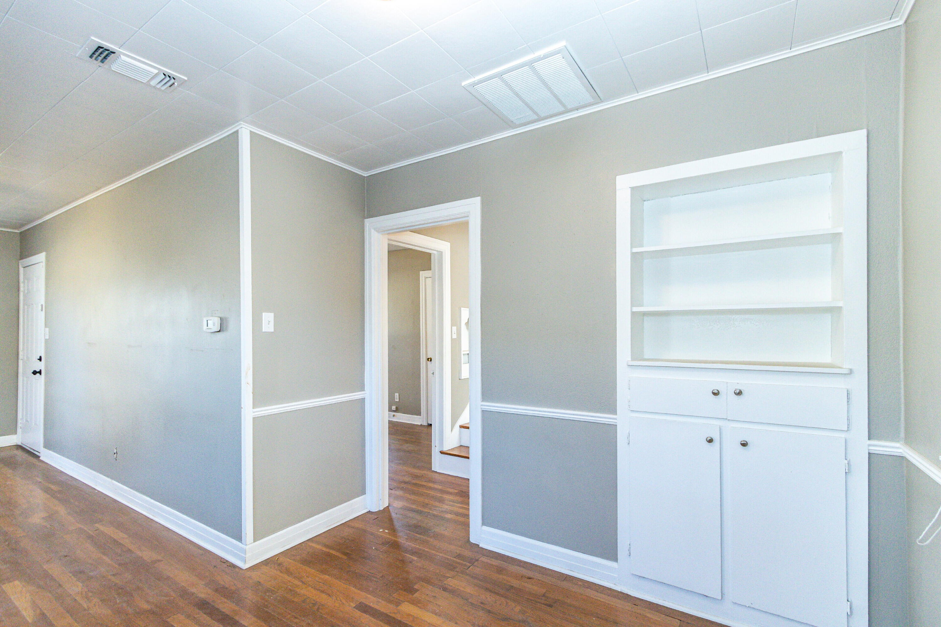 2417 25th Street Lubbock, TX 79411 - Photo 9 of 25 a view of a hallway with wooden floor