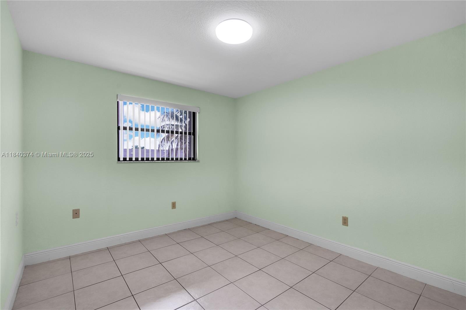 8425 Northwest 8th Street, Unit 304 Miami, FL 33126 - Photo 16 of 29 a view of a room with window and ceiling fan