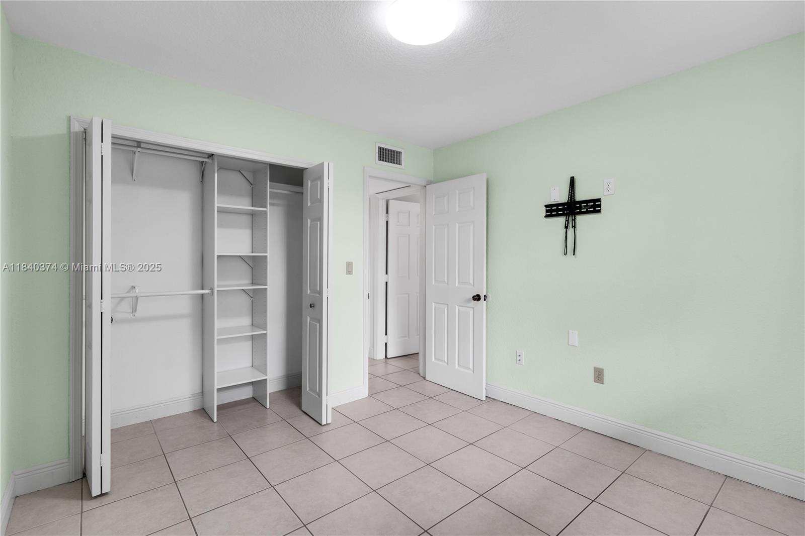 8425 Northwest 8th Street, Unit 304 Miami, FL 33126 - Photo 17 of 29 a view of an empty room