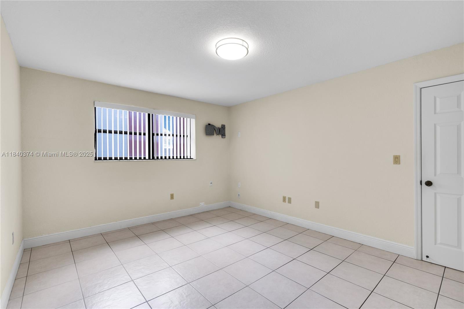 8425 Northwest 8th Street, Unit 304 Miami, FL 33126 - Photo 20 of 29 an empty room with windows