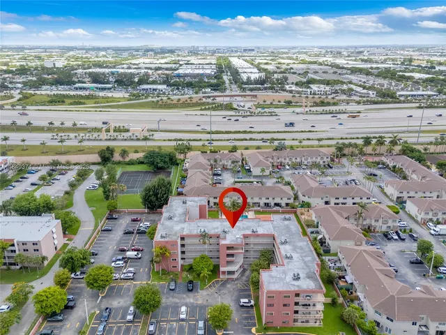 an aerial view of residential building and lake
