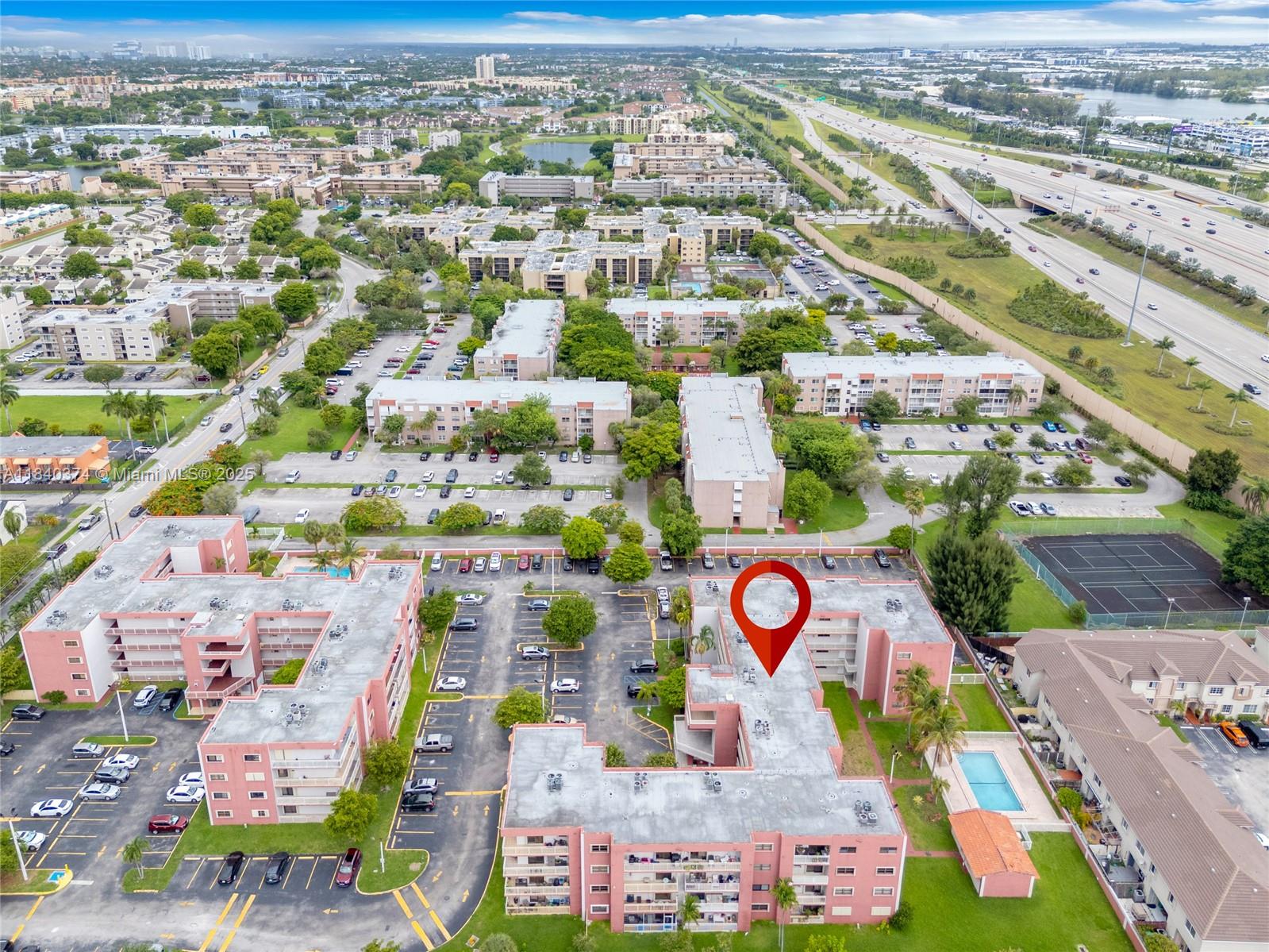 8425 Northwest 8th Street, Unit 304 Miami, FL 33126 - Photo 27 of 29 an aerial view of residential houses with outdoor space