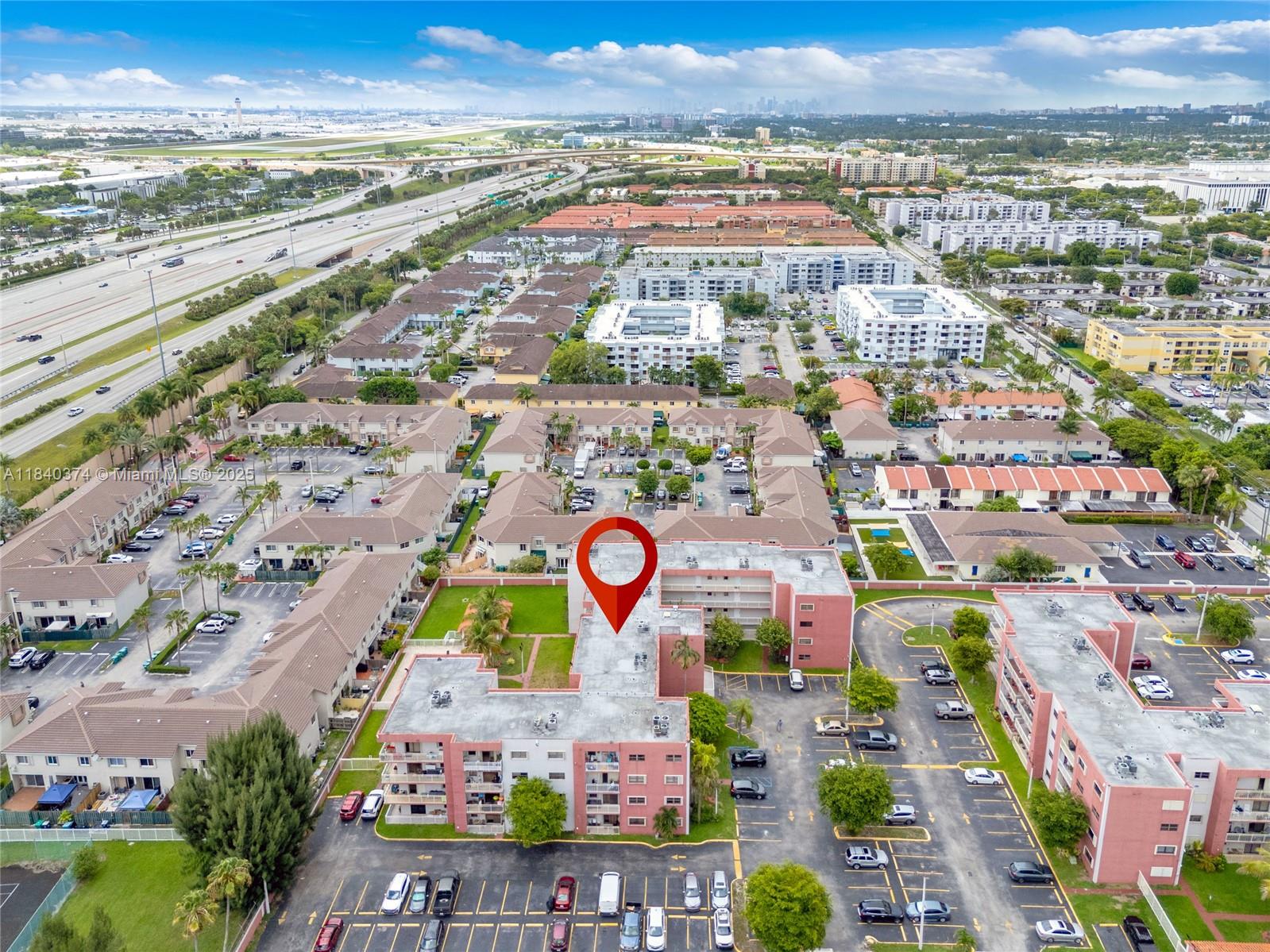 8425 Northwest 8th Street, Unit 304 Miami, FL 33126 - Photo 29 of 29 an aerial view of residential building and parking space