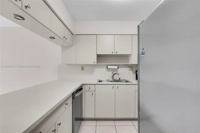 a kitchen with cabinets and appliances