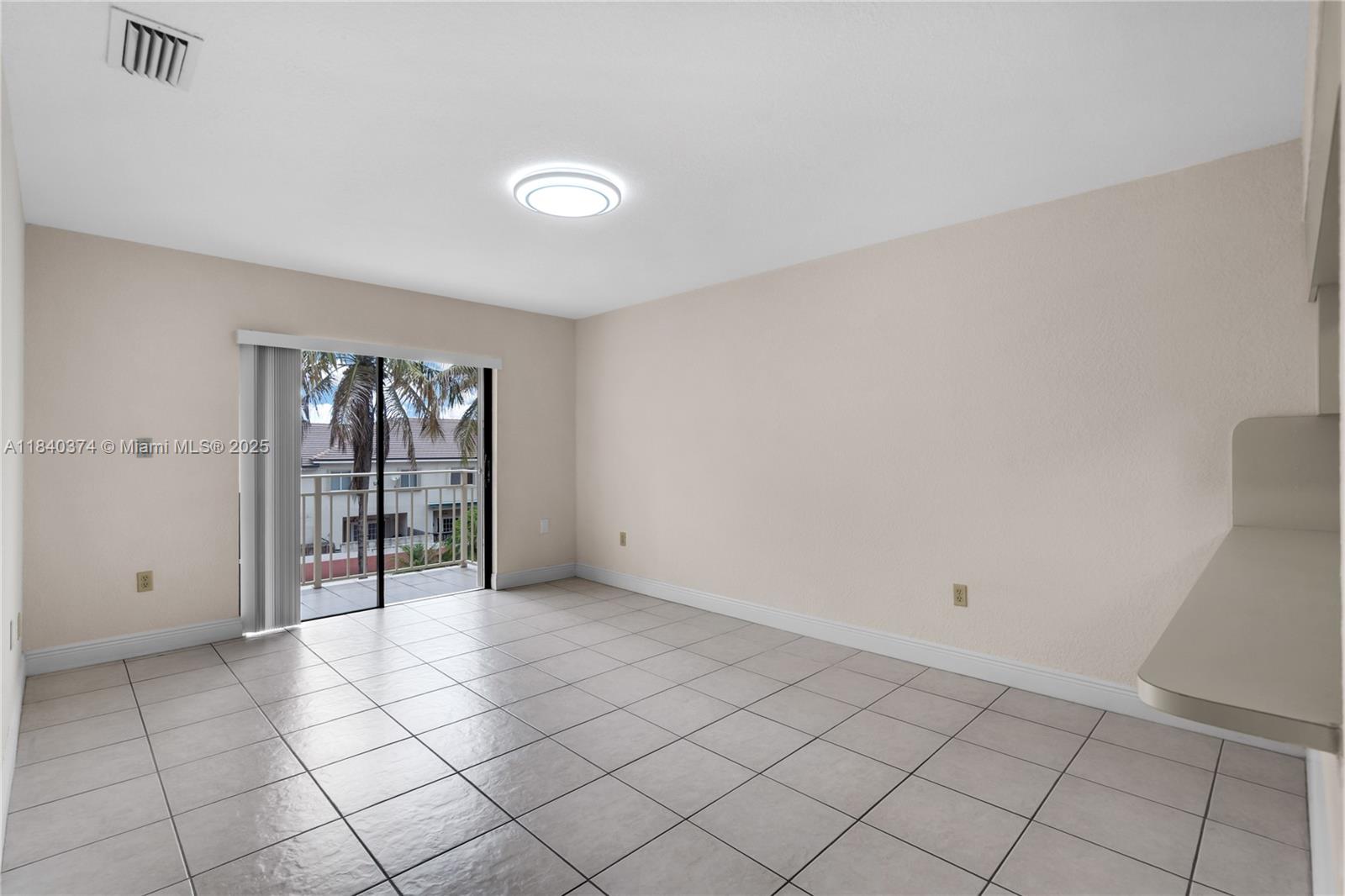 8425 Northwest 8th Street, Unit 304 Miami, FL 33126 - Photo 7 of 29 a view of an empty room and window