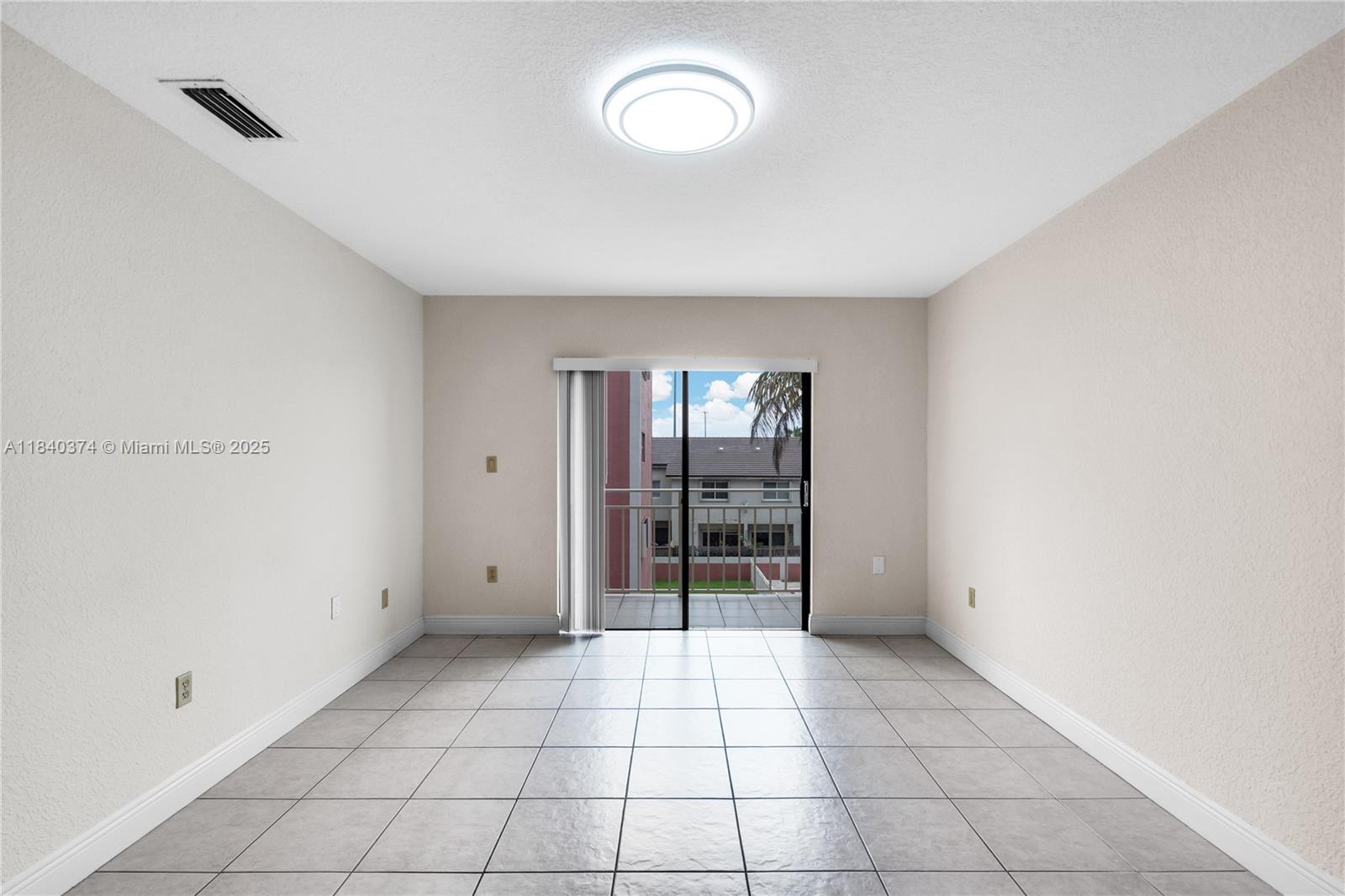 8425 Northwest 8th Street, Unit 304 Miami, FL 33126 - Photo 8 of 29 a view of an empty room with window