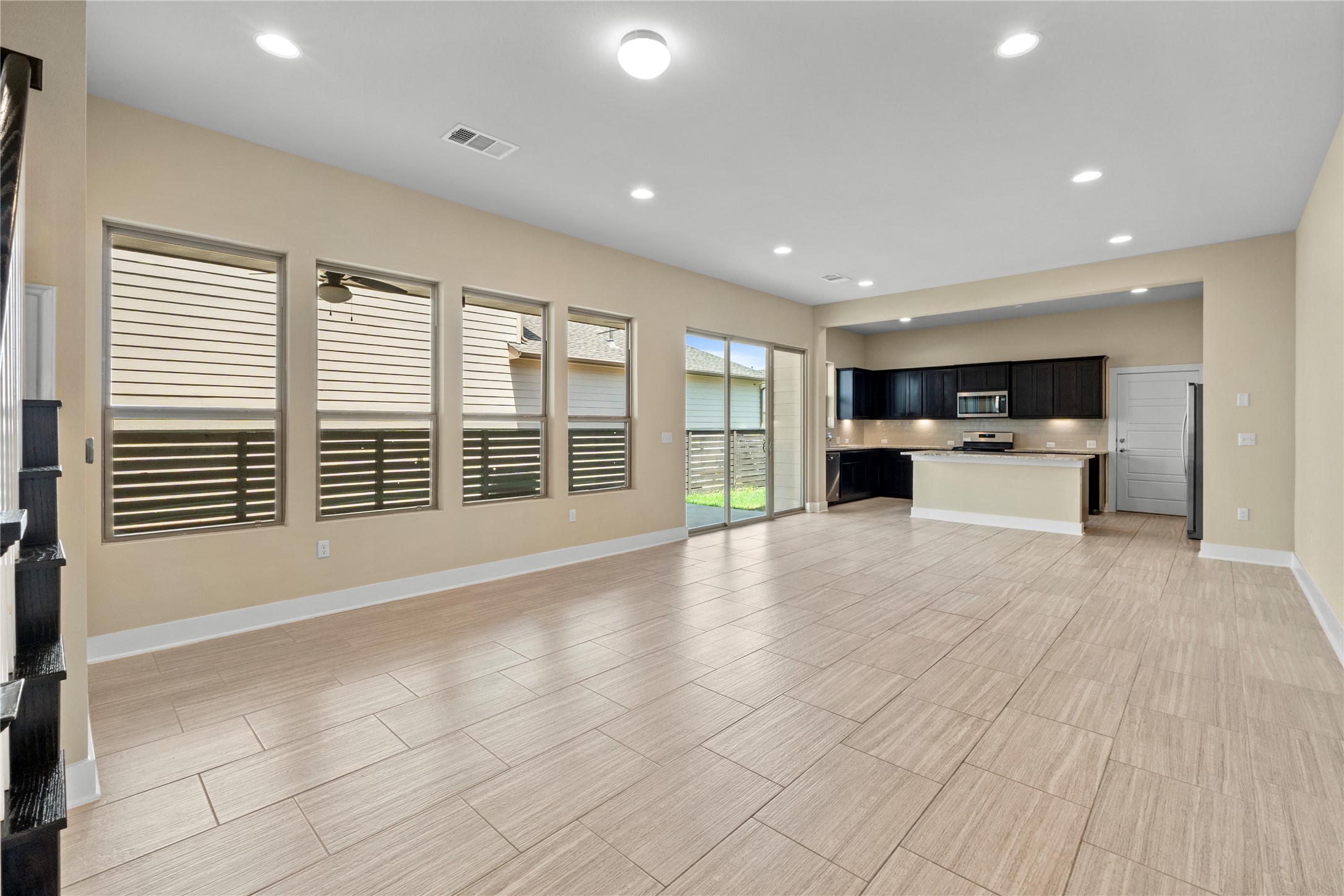 1709 Lawrence Street, Unit 5 Austin, TX 78741 - Photo 39 of 40 An open floor plan links the living area and kitchen under high ceilings.