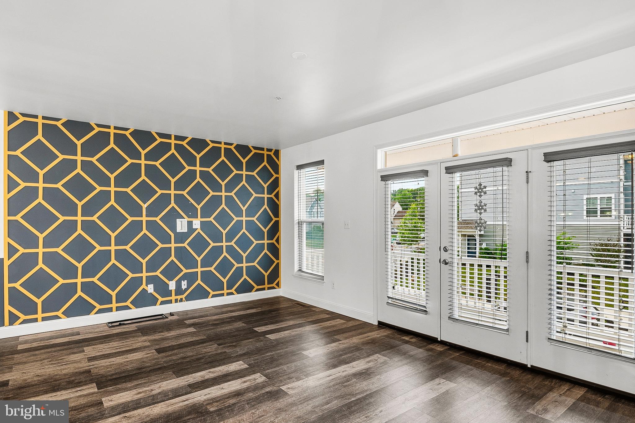 33 Greensborough Road Reisterstown, MD 21136 - Photo 22 of 40 a view of a livingroom with wooden floor and a gate