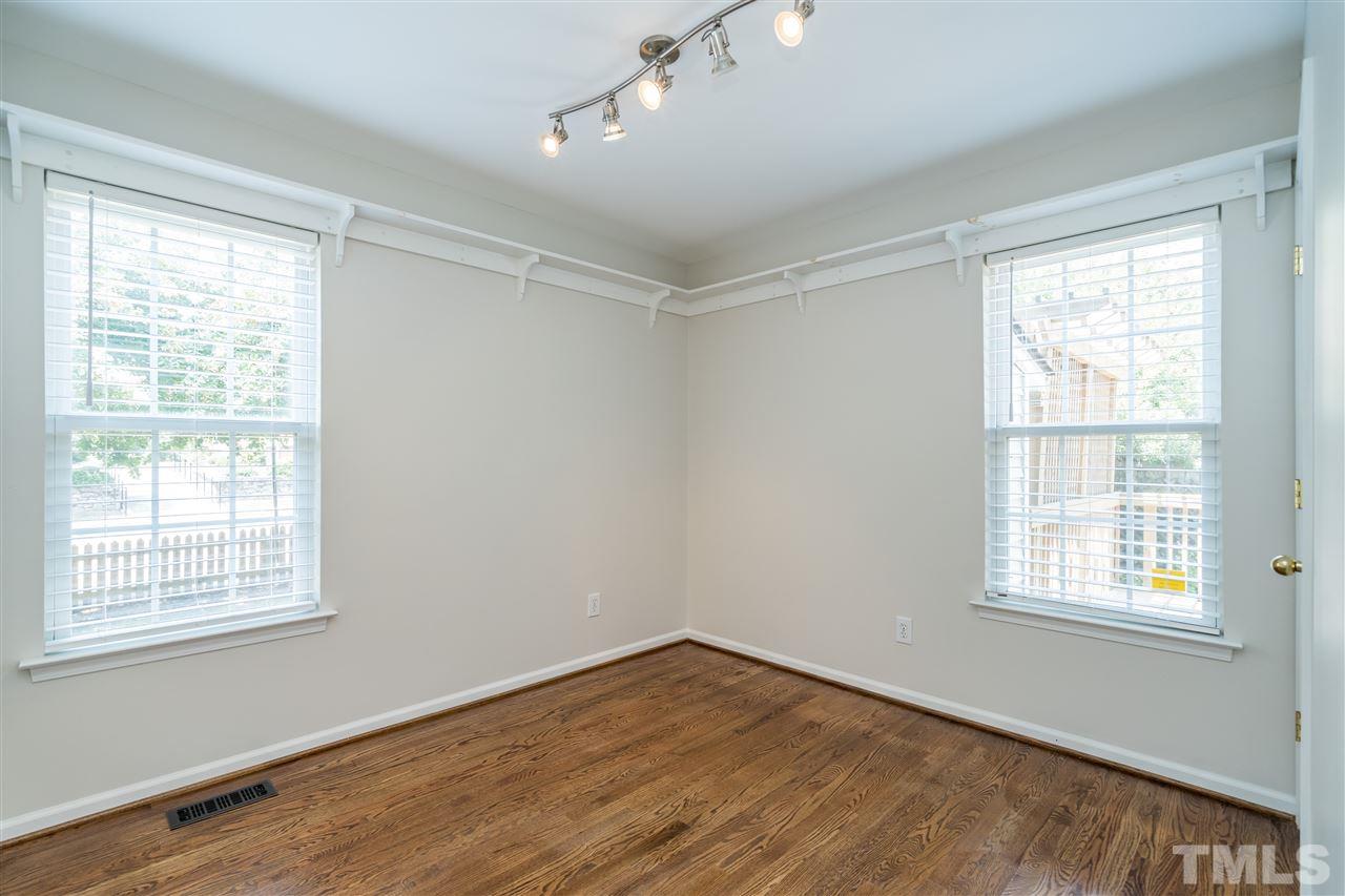 601 East Hargett Street Raleigh, NC 27601 - Photo 13 of 25 a view of an empty room with wooden floor and a window