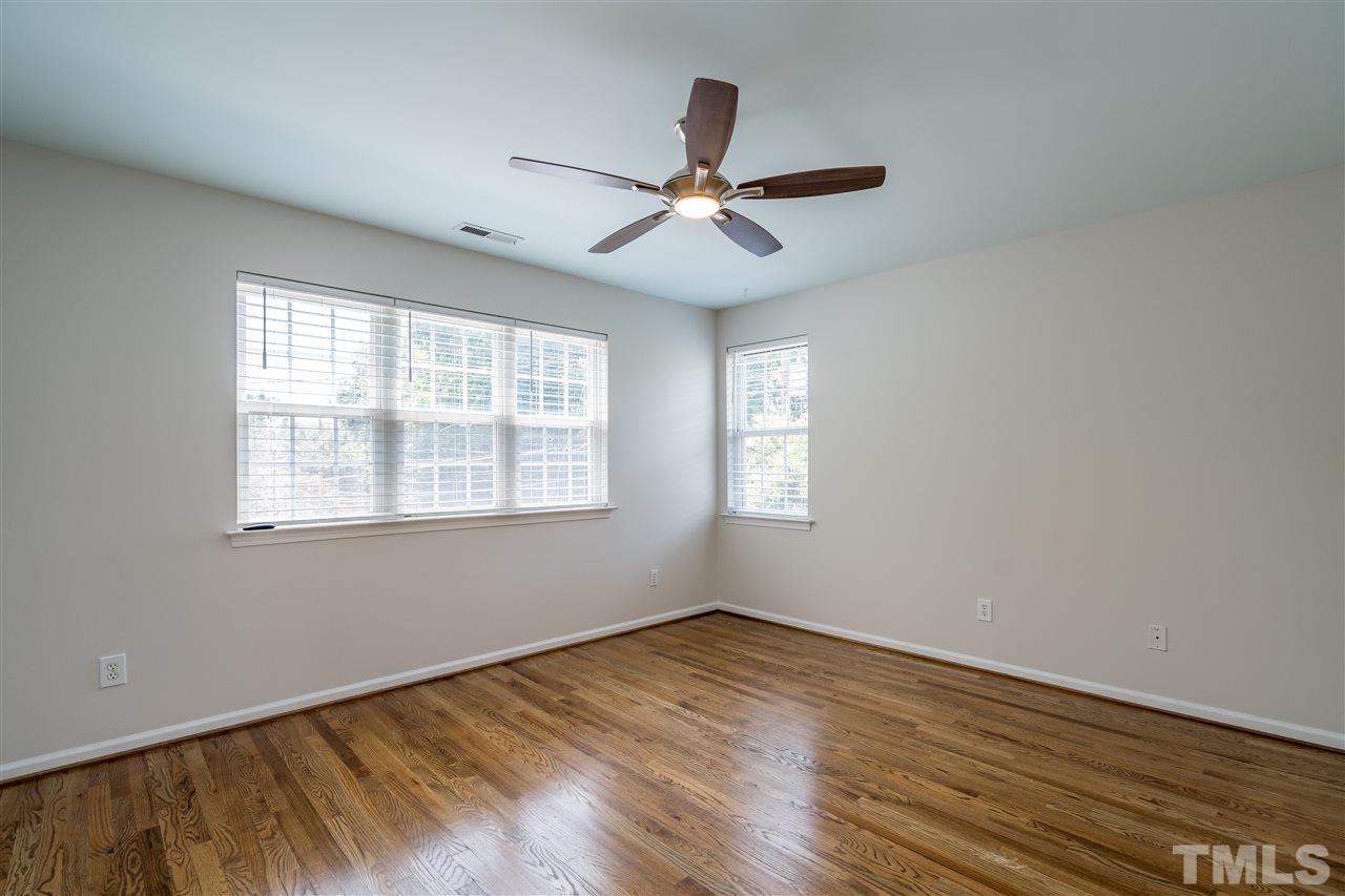 601 East Hargett Street Raleigh, NC 27601 - Photo 15 of 25 a view of empty room with wooden floor and fan