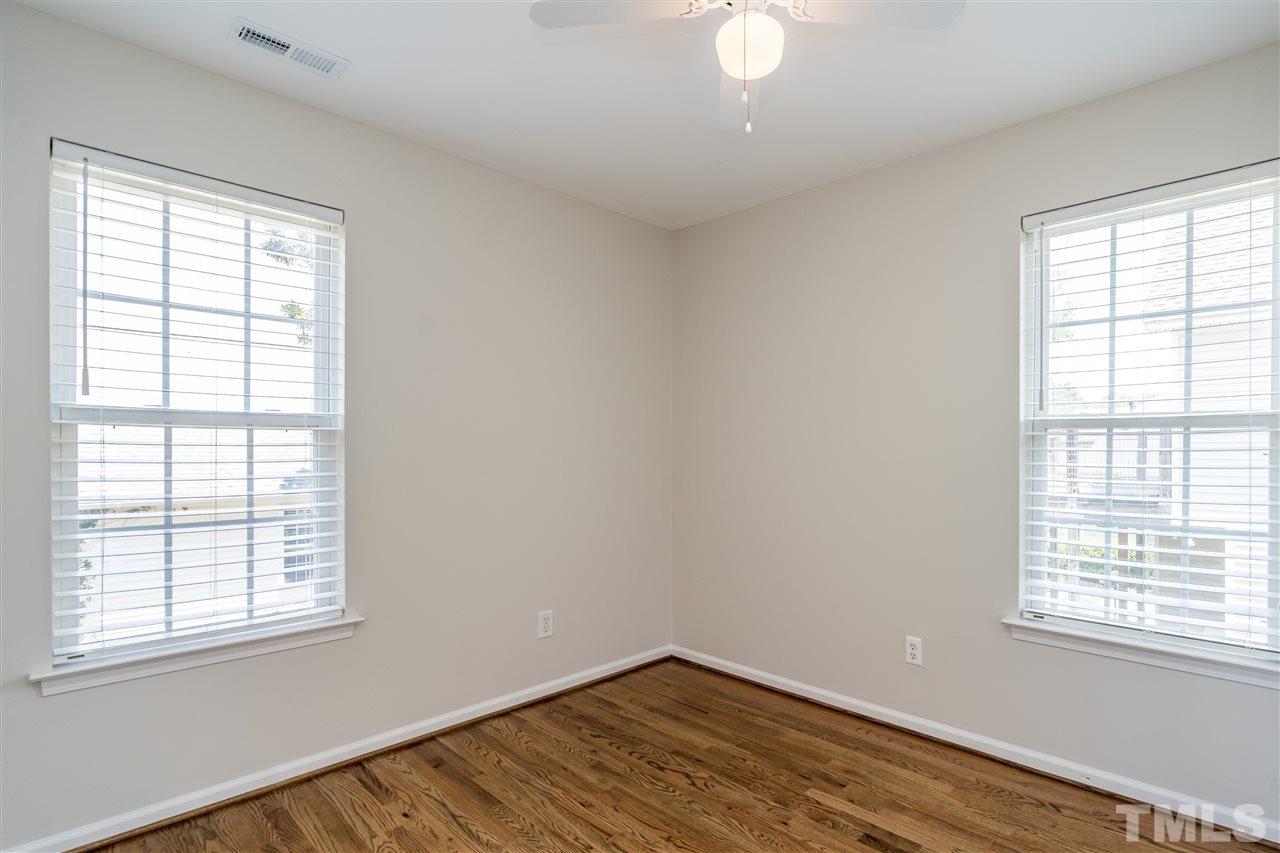 601 East Hargett Street Raleigh, NC 27601 - Photo 20 of 25 an empty room with wooden floor and windows