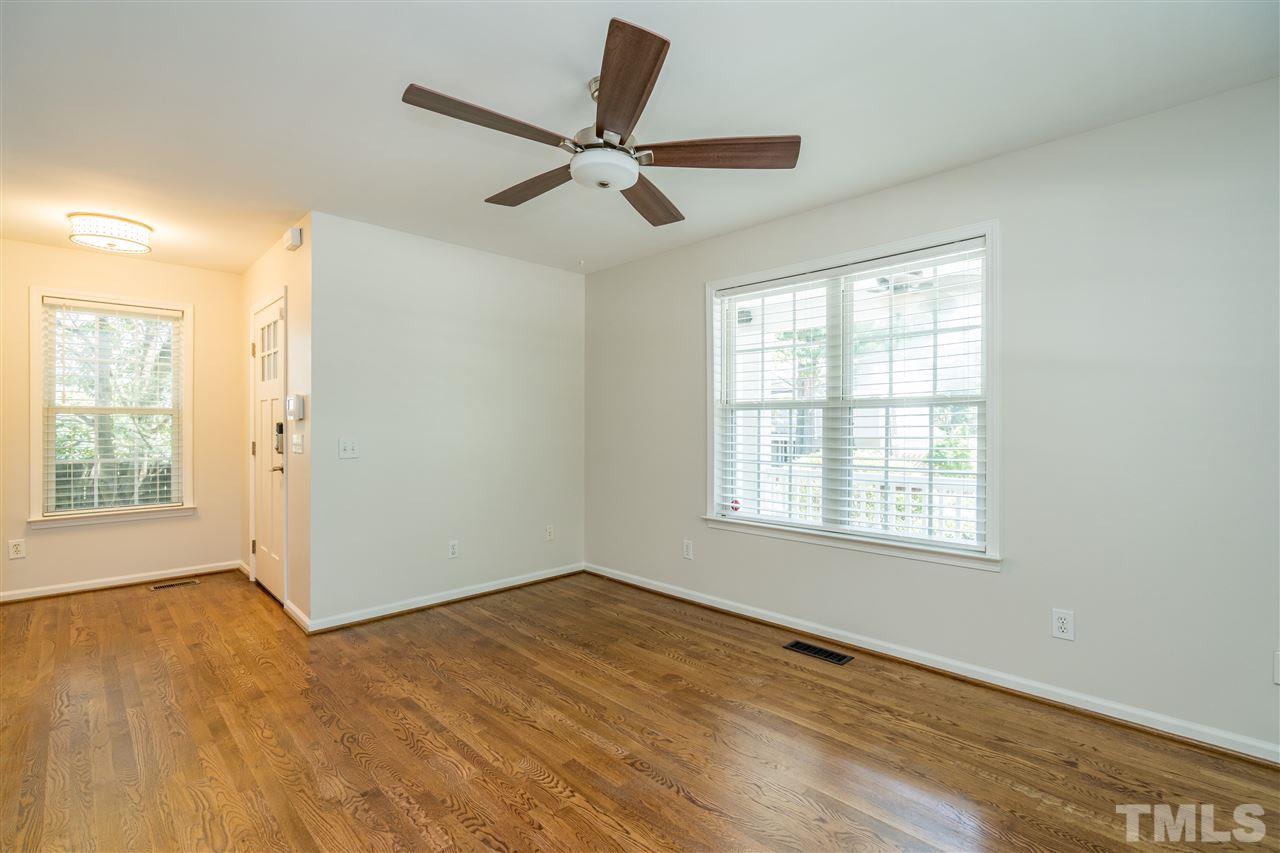 601 East Hargett Street Raleigh, NC 27601 - Photo 8 of 25 a view of a livingroom with a ceiling fan and window
