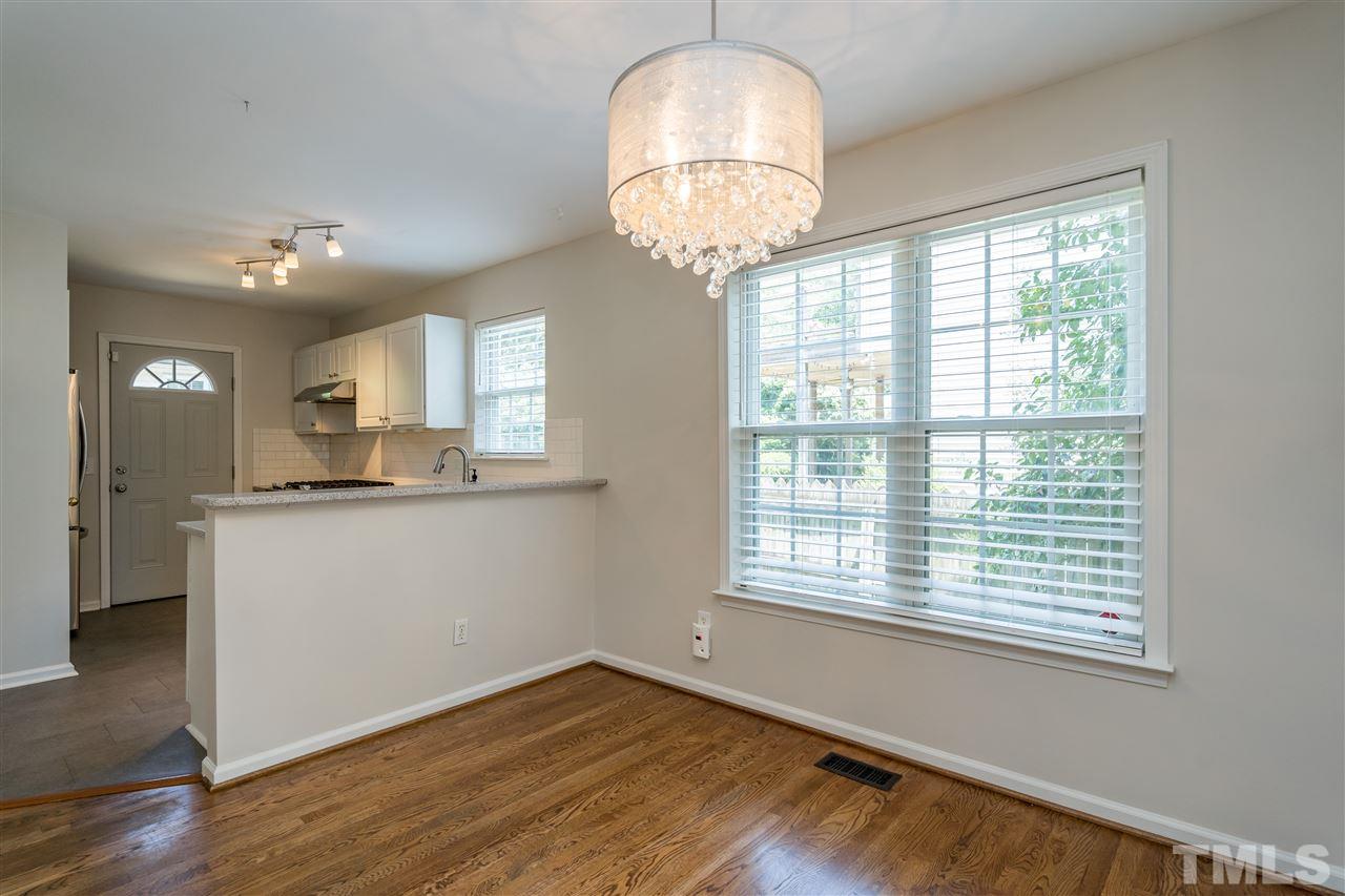 601 East Hargett Street Raleigh, NC 27601 - Photo 9 of 25 a view of a kitchen with wooden floor and a window