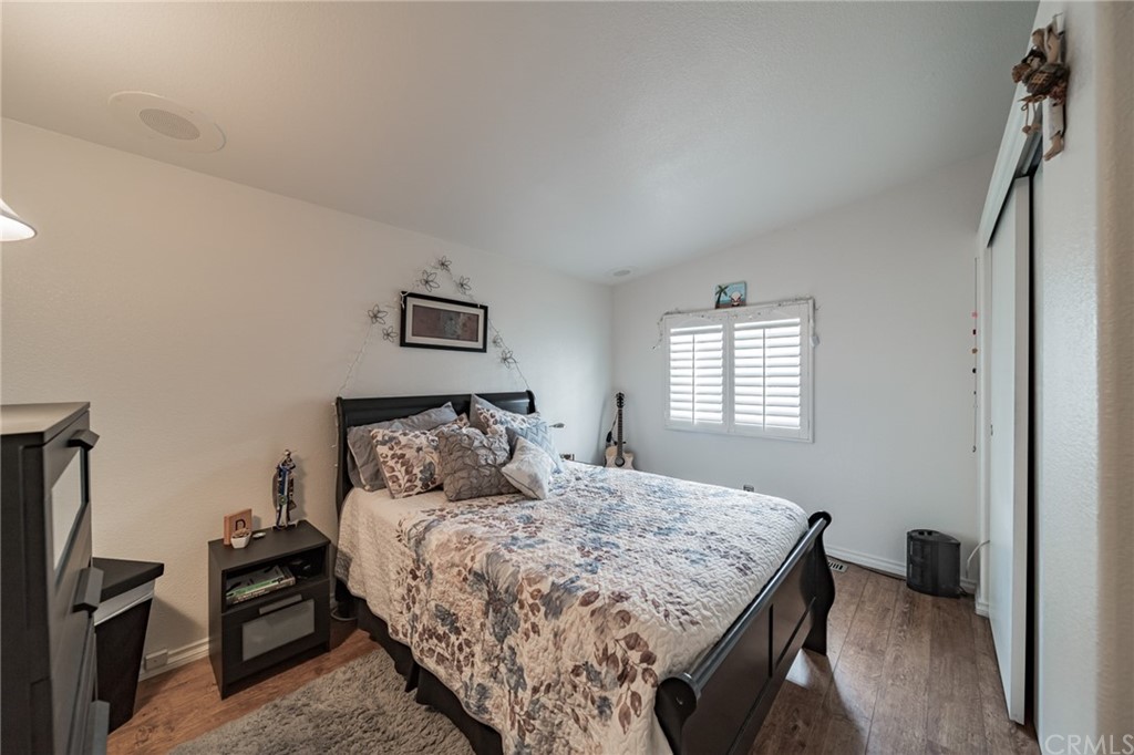 23301 Ridge Rte Drive, Unit 229 Laguna Hills, CA 92653 - Photo 11 of 26 a bed sitting in a bedroom next to a window