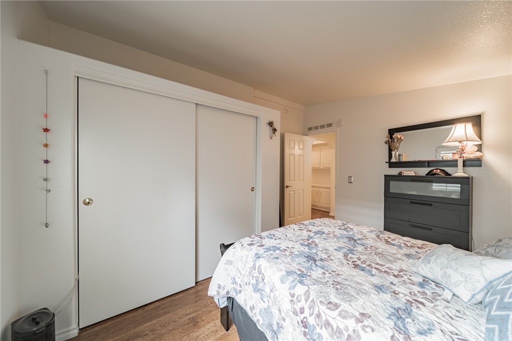 23301 Ridge Rte Drive, Unit 229 Laguna Hills, CA 92653 - Photo 12 of 26 a bedroom with a bed and a television