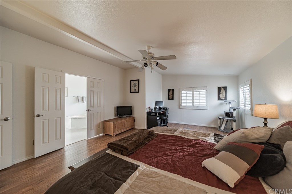 23301 Ridge Rte Drive, Unit 229 Laguna Hills, CA 92653 - Photo 16 of 26 a living room with furniture rug and wooden floor