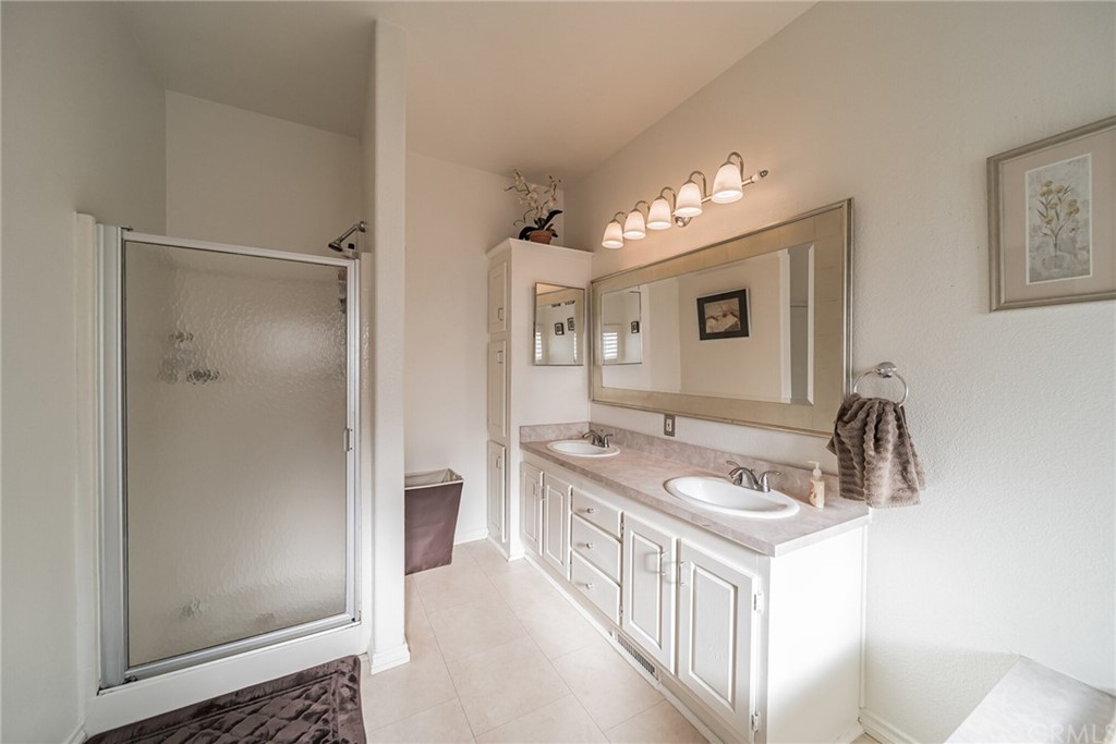23301 Ridge Rte Drive, Unit 229 Laguna Hills, CA 92653 - Photo 18 of 26 a bathroom with a sink and a mirror