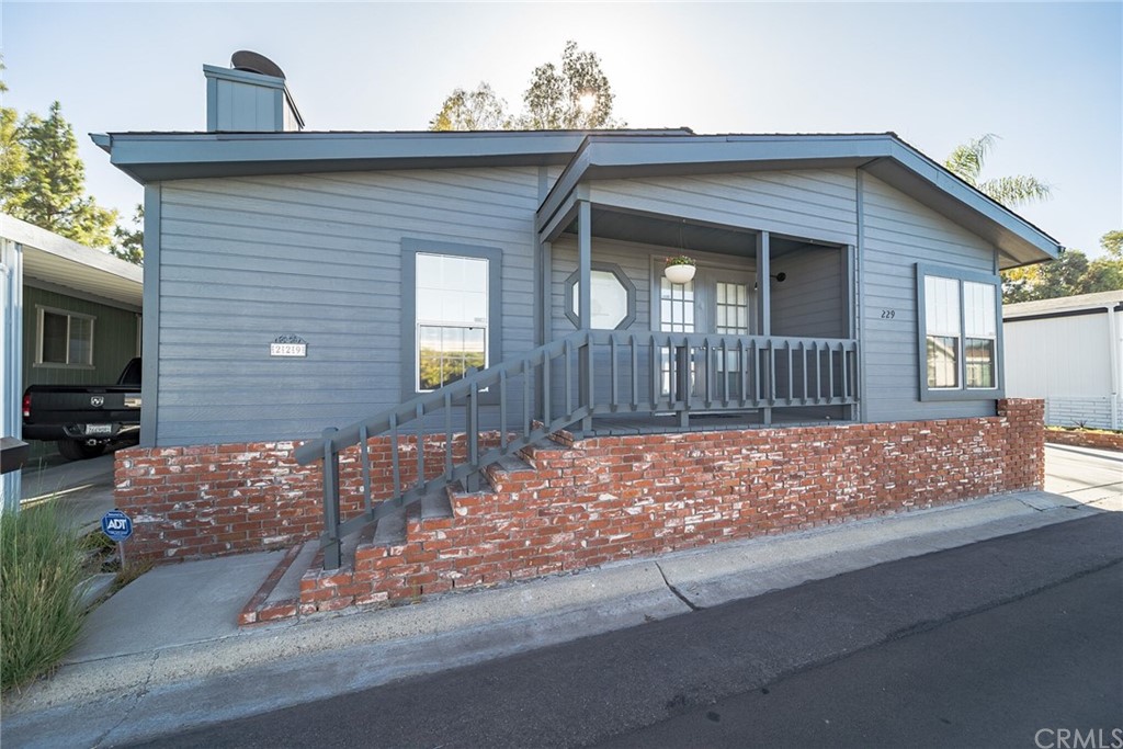 23301 Ridge Rte Drive, Unit 229 Laguna Hills, CA 92653 - Photo 21 of 26 a front view of a house with garden