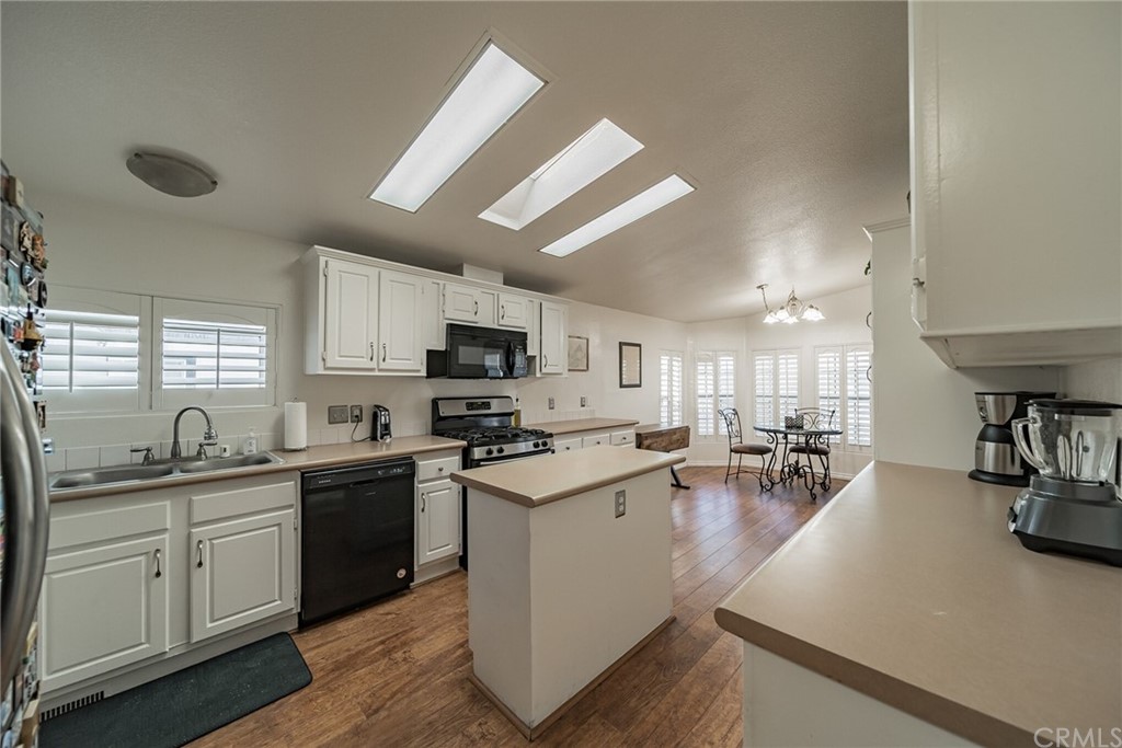 23301 Ridge Rte Drive, Unit 229 Laguna Hills, CA 92653 - Photo 4 of 26 a kitchen with lots of counter top space and appliances
