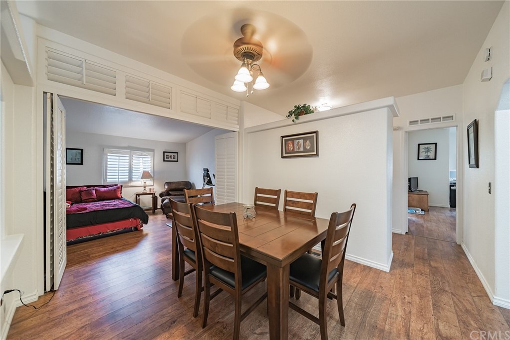 23301 Ridge Rte Drive, Unit 229 Laguna Hills, CA 92653 - Photo 8 of 26 a view of a dining room with furniture and wooden floor