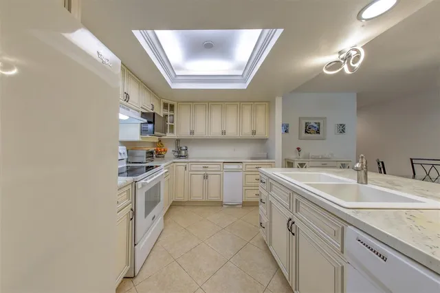 a living room with furniture and stairs