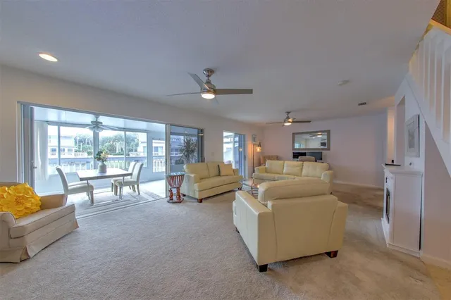 a living room with furniture and fireplace