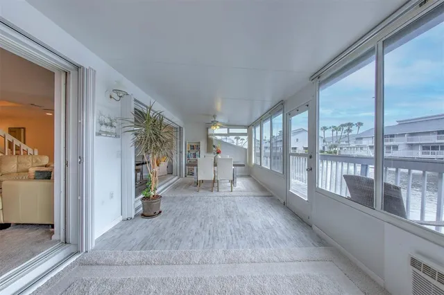 a living room with furniture and a dining table