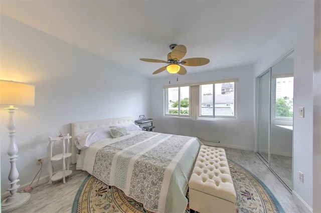 a bedroom with furniture and a rug