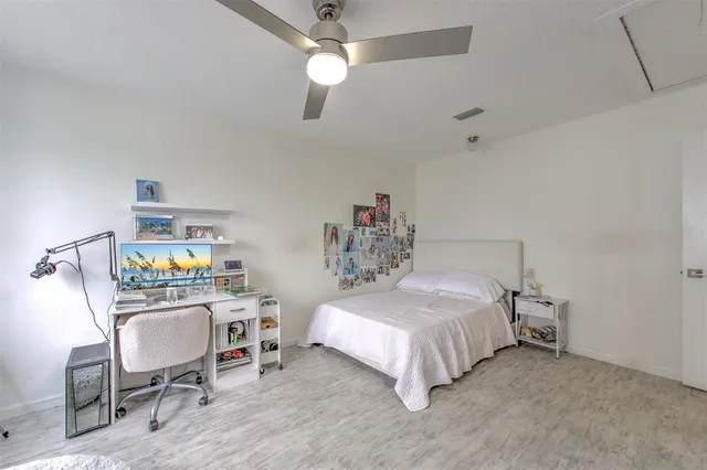 a view of balcony with wooden floor and fence