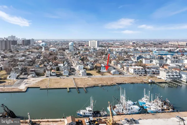 an aerial view of a house with a lake view