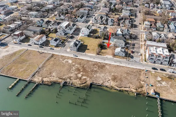 an aerial view of a house with a lake view