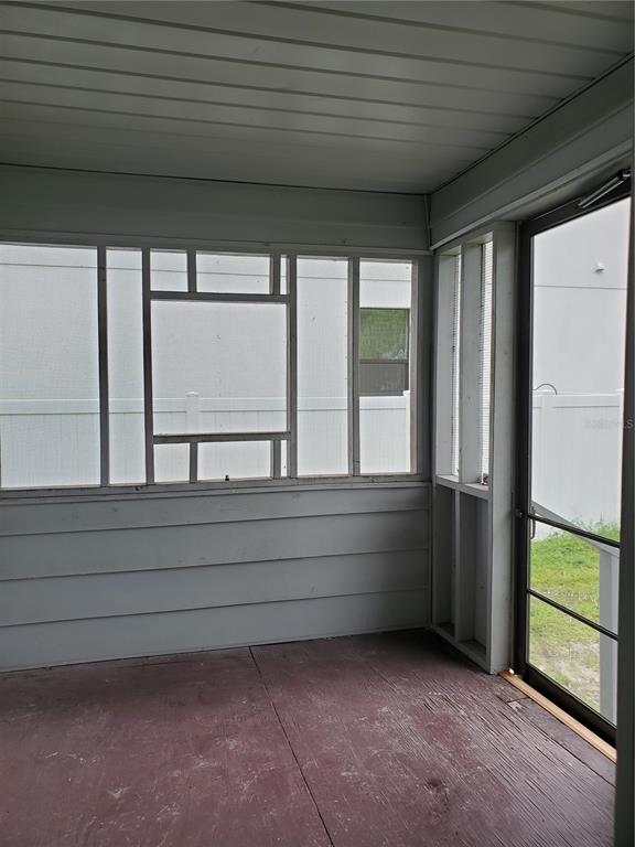 2703 West North A Street, Unit B Tampa, FL 33609 - Photo 2 of 10 a view of room with window and hardwood floor