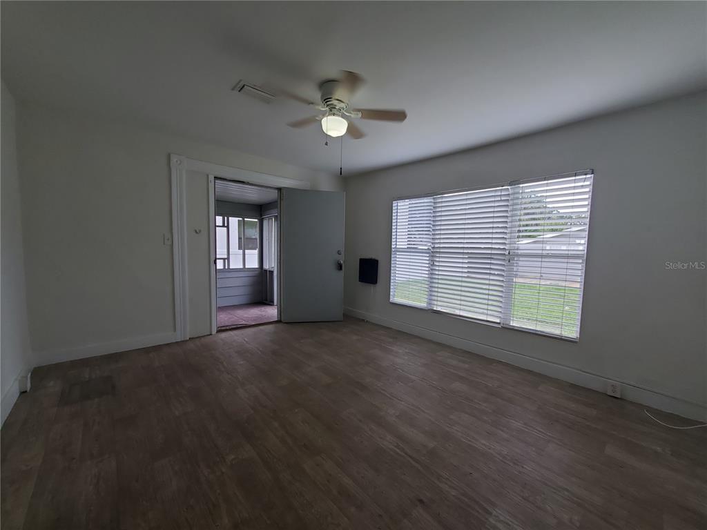 2703 West North A Street, Unit B Tampa, FL 33609 - Photo 4 of 10 a view of a livingroom with a ceiling fan and window