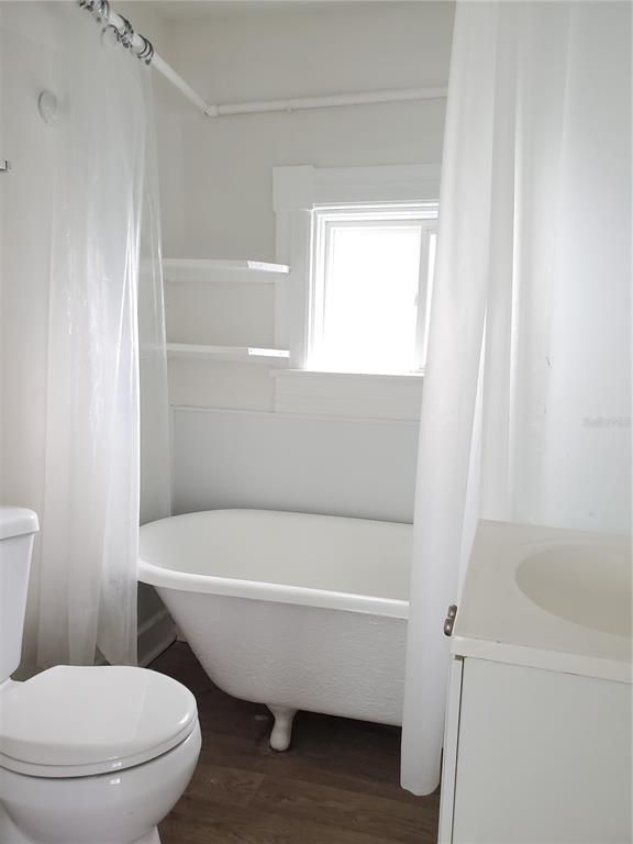 2703 West North A Street, Unit B Tampa, FL 33609 - Photo 6 of 10 a bathroom with a toilet and a bathtub